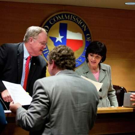 Texas Railroad Commissioners Wayne Christian and Christi Craddick sign commission final orders after the bi-weekly commissioners' conference, Tuesday, May 23, 2017, in Austin, Texas.